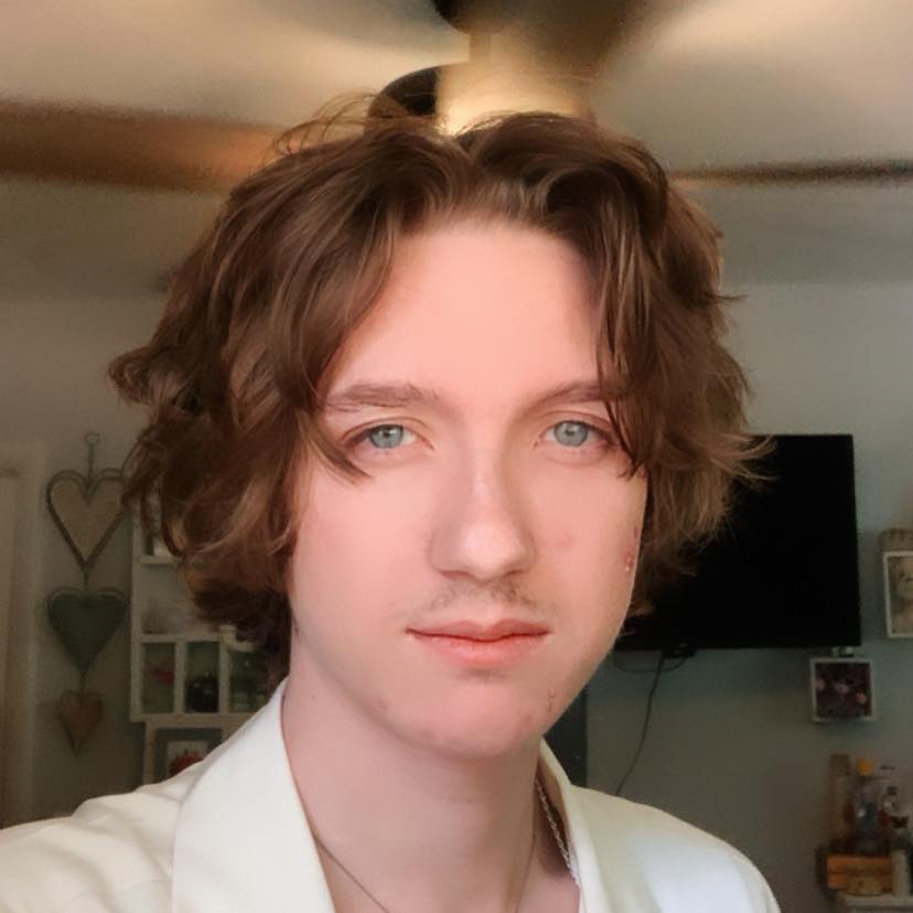 a man standing with watch on his hand looking at the watch